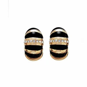 Gold Tone Black Segmented Reversible Hugs®